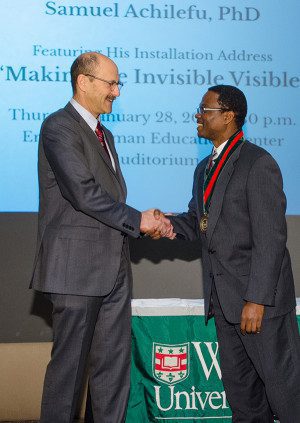 David H. Perlmutter, MD, (left) congratulates Samuel Achilefu, PhD, after Achilefu was named the inaugural Michel M. Ter-Pogossian Professor of Radiology.