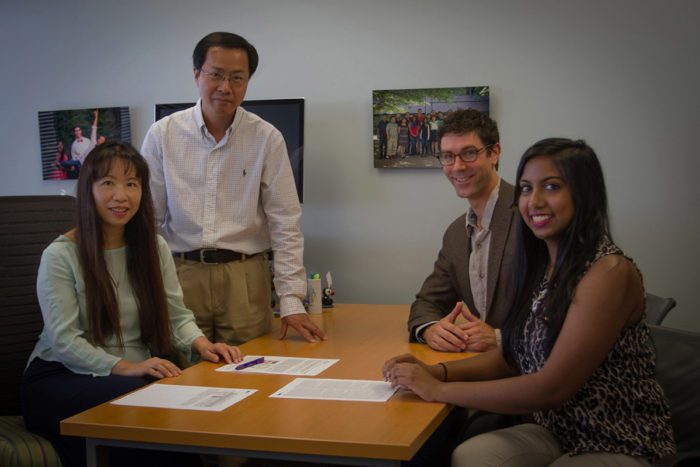From left, senior author Li Ding meets with study co-authors Feng Chen, Matthew Bailey and Sohini Sengupta.
