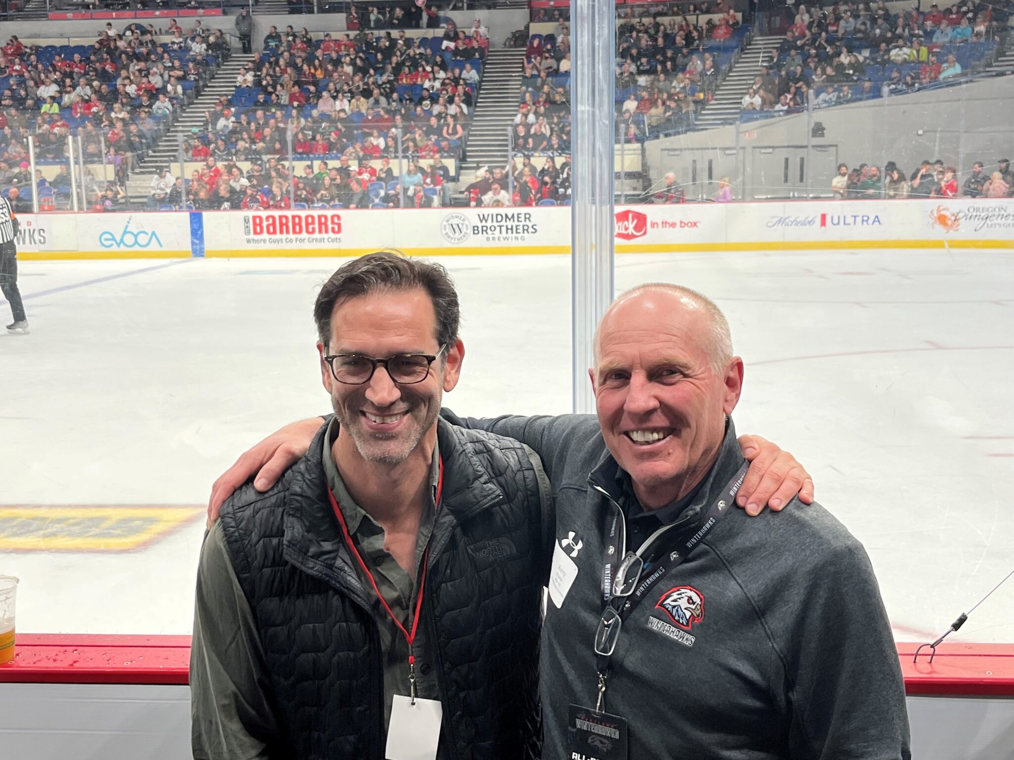 Washington University medical oncologist Russell Pachynski, MD, and his patient Kerry Preete attend a St. Louis Blues game together.